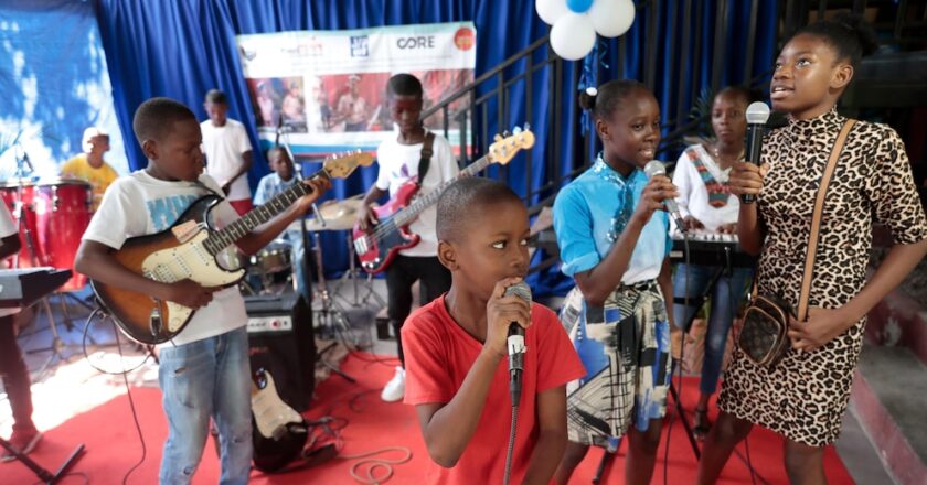 Haitian students play drums and strum guitars to escape hunger and gang violence